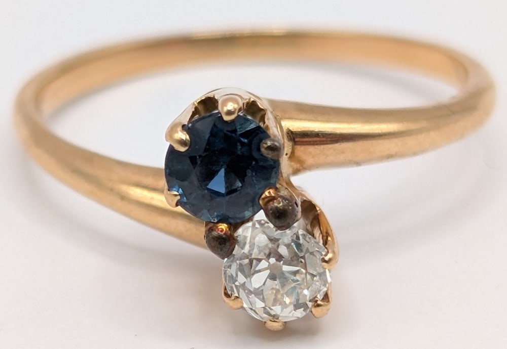 10K Gold Diamond & Sapphire Ring: 10K yellow gold ring with round cut diamond and blue sapphire prong set. Ring is size 5 and weighs 2.2 grams.