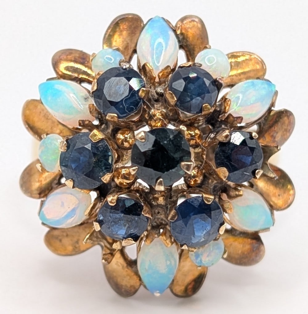 10K Gold Opal & Sapphire Ring: 10K yellow gold vintage ring with prong set opal and blue sapphires. Ring is size 9 and weighs 6.1 grams.