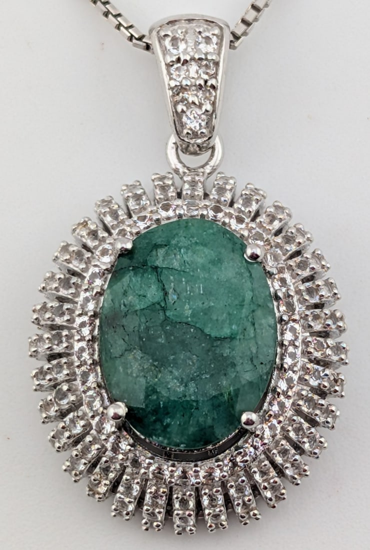 Sterling 8.50 ctw Emerald & White Sapphire Pendant Necklace: Sterling 8.50 ctw oval cabochon dyed green beryl (emerald) with 133 round faceted 1.50 ctw white sapphire pendant on 18" sterling silver chain. Total weight is 7.8 grams. Necklace comes with GGA appra