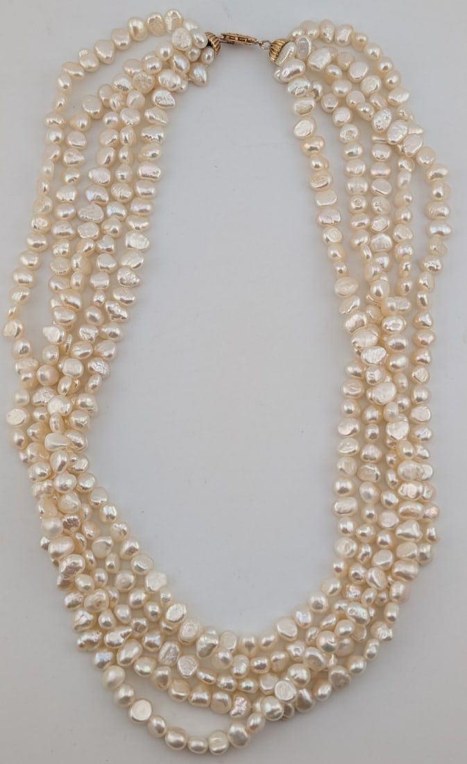 14K Gold Clasp 5 Strand Freshwater Pearl Necklace: 14K yellow gold clasp 5 strand freshwater pearl necklace. Measures 18".