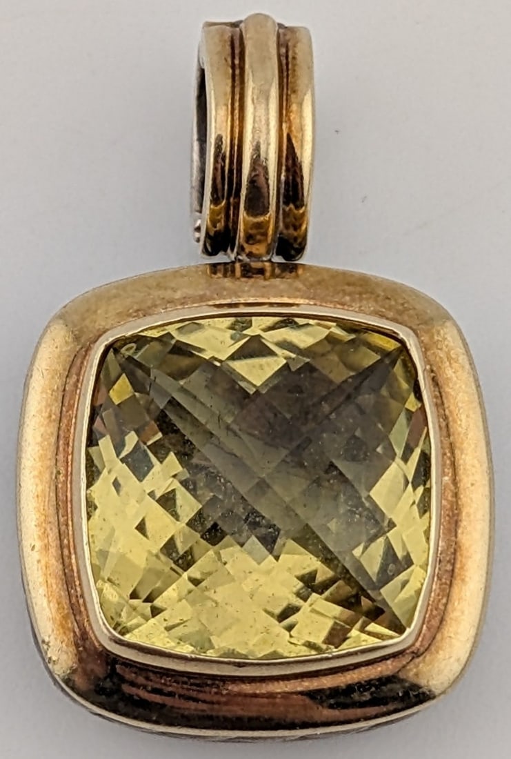 David Yurman Sterling & 18K Gold 8 CT Lemon Citrine Albion Pendant Enhancer: Designer David Yurman sterling silver and 18K yellow gold enhancer pendant with 8 CT lemon citrine gemstone. Pendant weighs 13.3 grams.