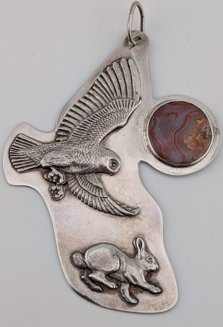 Vintage Sterling Southwestern Owl & Rabbit W/ Agate Stone Pendant: Vintage sterling silver southwestern design large pendant showing an owl chasing a rabbit with an agate stone moon. Pendant measures 4" tall and 3" wide. Pendant weighs 45 grams.