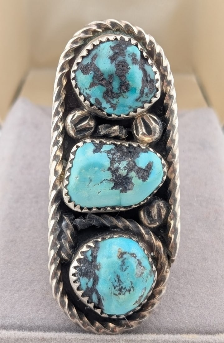 Vintage Sterling Navajo P. Padilla Three Kingman Turquoise Long Ring: Vintage Navajo P. Padilla signed on shank sterling silver Three Kingman long ring with 3 turquoise stones. Ring is size 4.5 and weighs 15.3 grams.