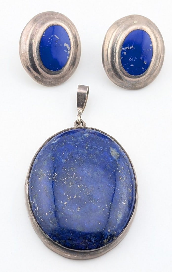 Vintage Sterling Taxco Lapis Lazuli Pendant and Earrings Set: Vintage sterling silver Taxco Mexico large oval blue lapis Lazuli stone pendant and pair of inlaid blue lapis earrings. Total weight of set is 33 grams.