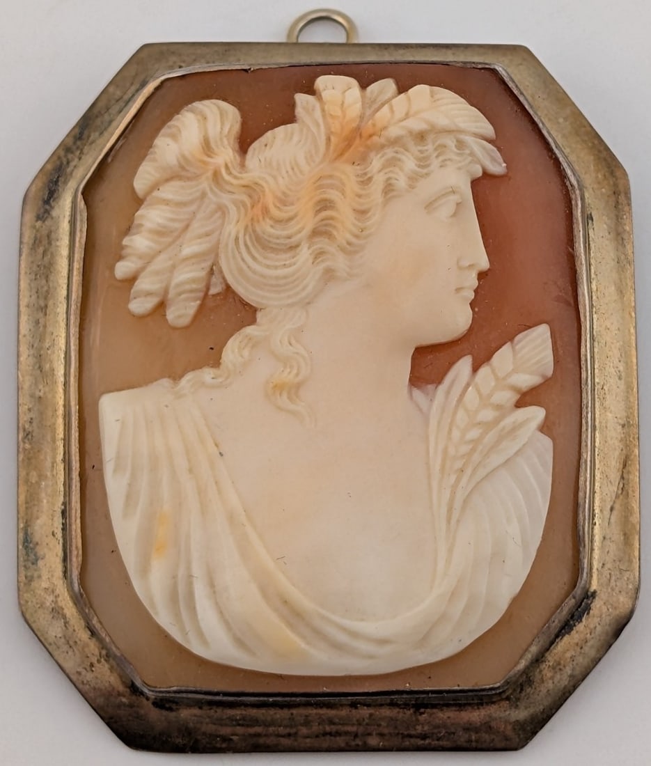 Victorian Sterling Hand Carved Cameo Shell Pendant/Brooch: Victorian Sterling silver framed brooch/pendant with hand carved cameo in shell. Pendant measures 1 3/4" by 1.5" and weighs 13.5 grams.