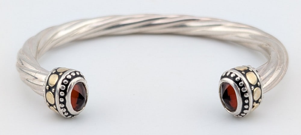 Vintage Sterling Garnet Open Cuff Twisted Rope Bracelet: Vintage Sterling silver twisted rope open cuff bracelet with two faceted garnets. Bracelet weighs 17 grams.