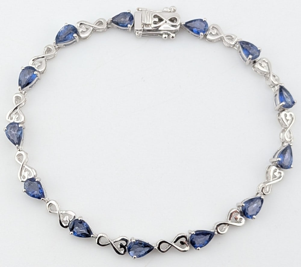 Sterling Pear Cut Tanzanite 4.24 ctw Bracelet: Sterling silver 4.24 ctw Tanzanite bracelet The bracelet measures 7" long and weighs 6.7 grams. It comes with a GGA Appraisal Report with an estimated retail replacement value of $1790.