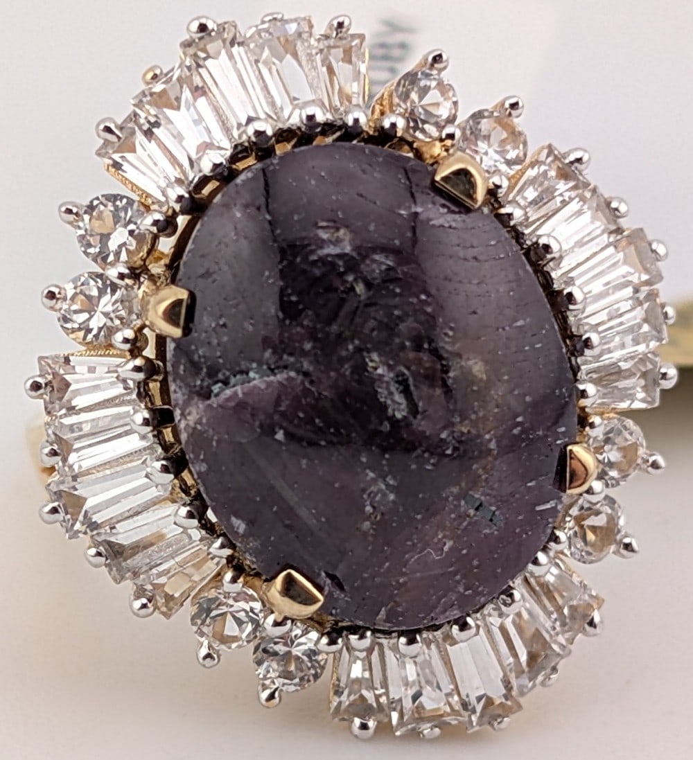 Sterling Gold Overlay 28.68 CT Star Ruby & Sapphire Ring: Sterling silver star Ruby halo ring. The Ruby is 28.68 CT and the baguette white sapphire halo has a ctw of 2.45. The ring comes with an AIG Gem laboratory report with a replacement appraisal estimate