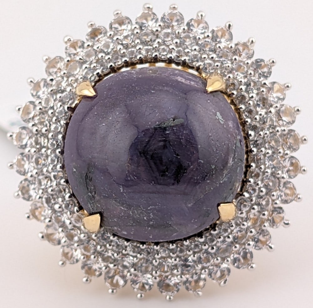 Sterling Gold Overlay 30.27 CT Star Ruby & Sapphire Halo Ring: Sterling silver star Ruby halo ring. The Ruby is 30.27 CT and the triple round cut white sapphire halo is 3.44 CT. The ring comes with an AIG Gem laboratory report with a replacement appraisal estimat