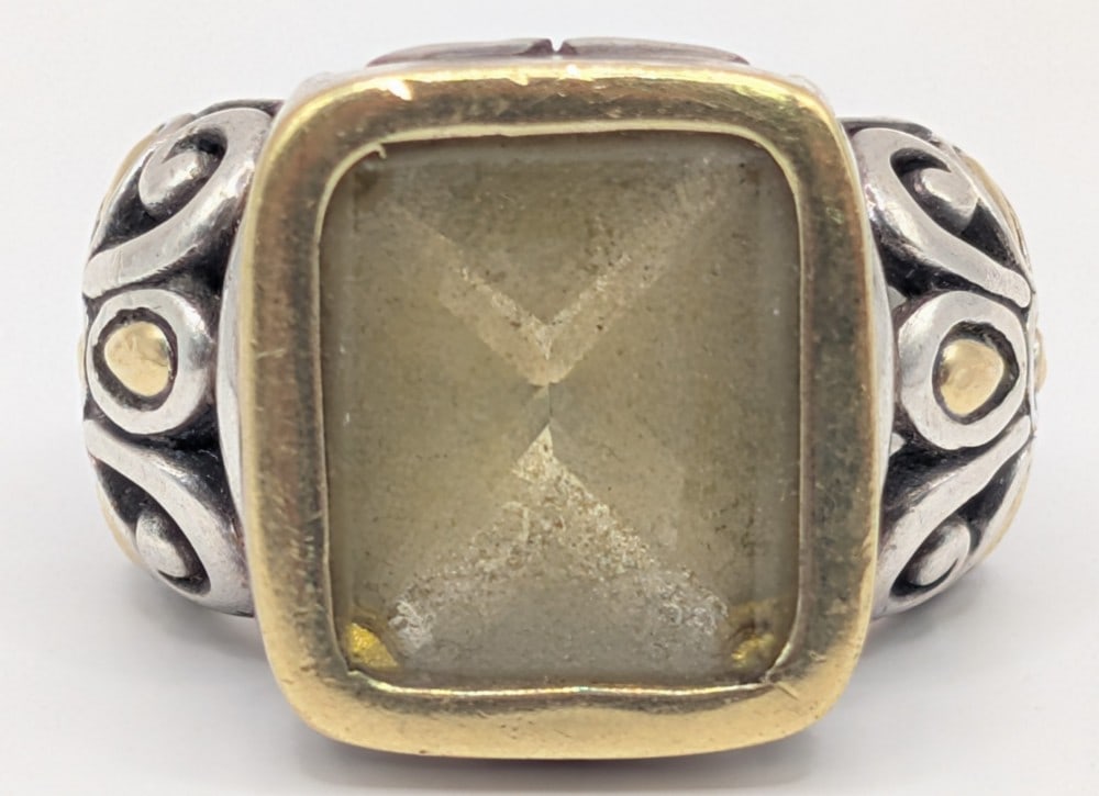 Sterling & 18K Gold Filigree Citrine Ring: Sterling silver and 18K yellow gold ring with bezel set citrine and filigree floral band. Ring is size 6.5 and weighs 12 grams.