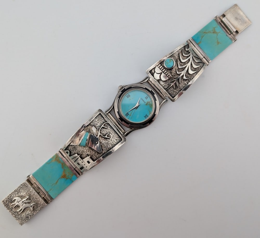 Lorenzo Tafoya Sterling Inlaid Genuine Stone Kingman Turquoise Navajo Mens Watch: Beautiful mens vintage sterling silver Navajo made Lorenzo Tafoya watch with inlaid genuine stone kingman turquoise. The watch depicts a harvest, deer and a man on a donkey. Stamped on the back LT wit
