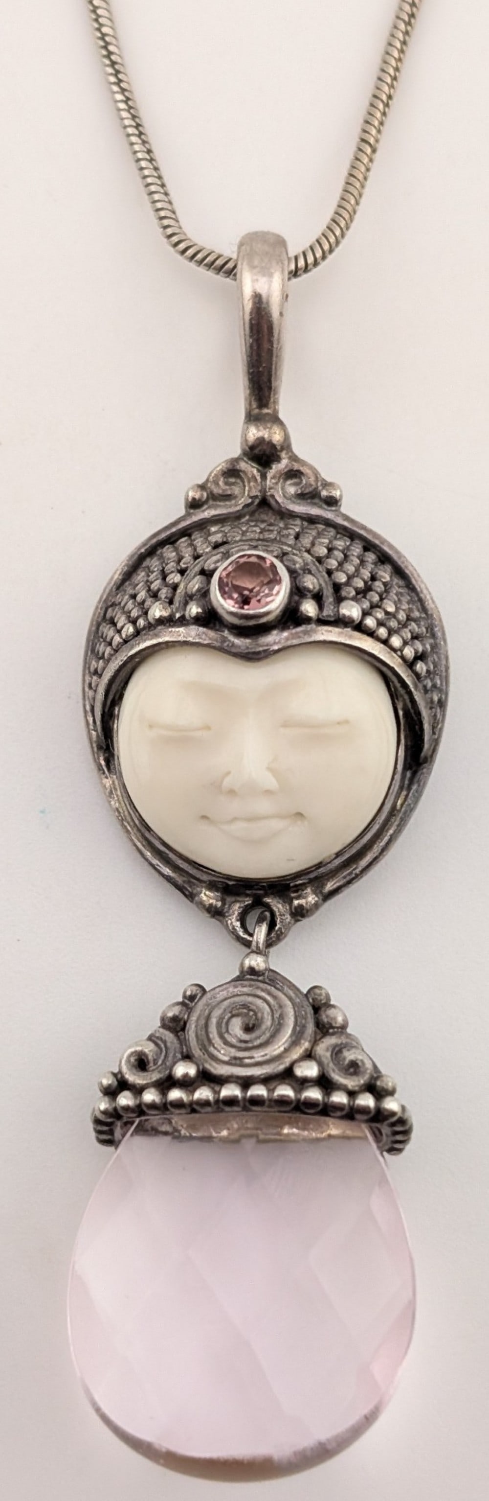 Vintage Sterling Sajen Carved Goddess & Pink Quartz Pendant Necklace: Vintage Sterling silver Sajen moon face goddess carved bovine bone pendant with pink quartz charm. Pendant measures 2.5" long and is on an 18" sterling silver chain. Total weight is 20.7 grams.
