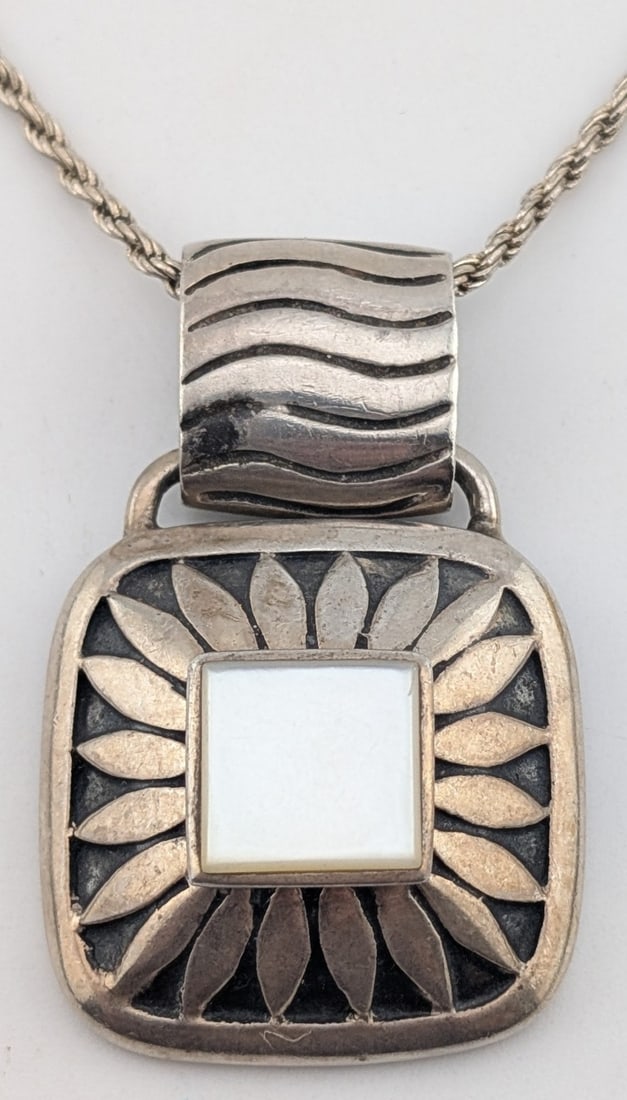 Vintage Sterling MOP Flower Pendant Necklace: Vintage Sterling silver flower pendant with square mother of pearl. Pendant is on an 18" sterling silver twisted chain and total weight is 21.3 grams.