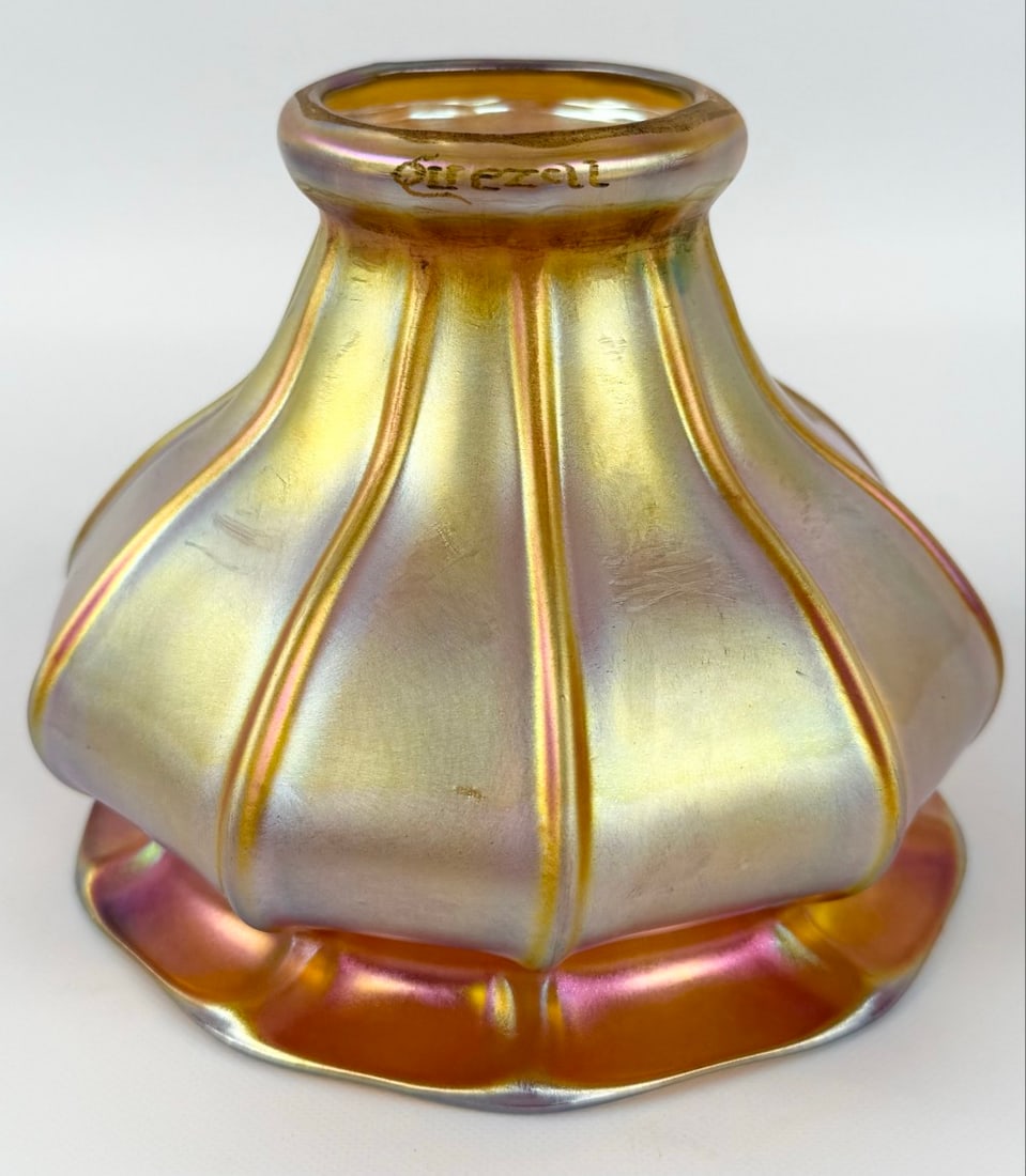 Signed Quezal Art Glass Gold Aurene Lamp Shade: Signed Quezal Art Glass Gold Aurene Lamp Shade. The shades shade has a 2-1/4" fitter and is in good condition. Overall measures approximately 4-1/8" tall x 5" across at the opening.