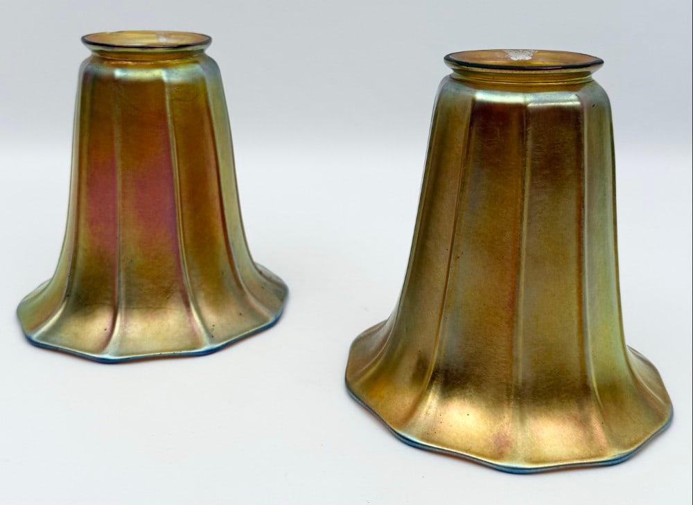 Pair Of Signed Steuben Art Glass Gold Aurene Lamp Shades: Pair Of Signed Steuben Art Glass Gold Aurene Lamp Shades. The shades have 2-1/4" fitters and are in good used condition with a small nick on one of the fitters. Overall they measure approximately 5" t