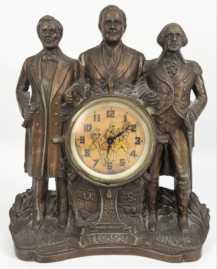 1930's Era United Steerman Of U.S.A. Roosevelt-Washington-Lincoln Mantle Clock: 1930's Era United Steerman Of U.S.A. Roosevelt-Washington-Lincoln Mantle Clock. The base metal clock has a bronze finish and features the trio holding hands. Displays well with some age and display we