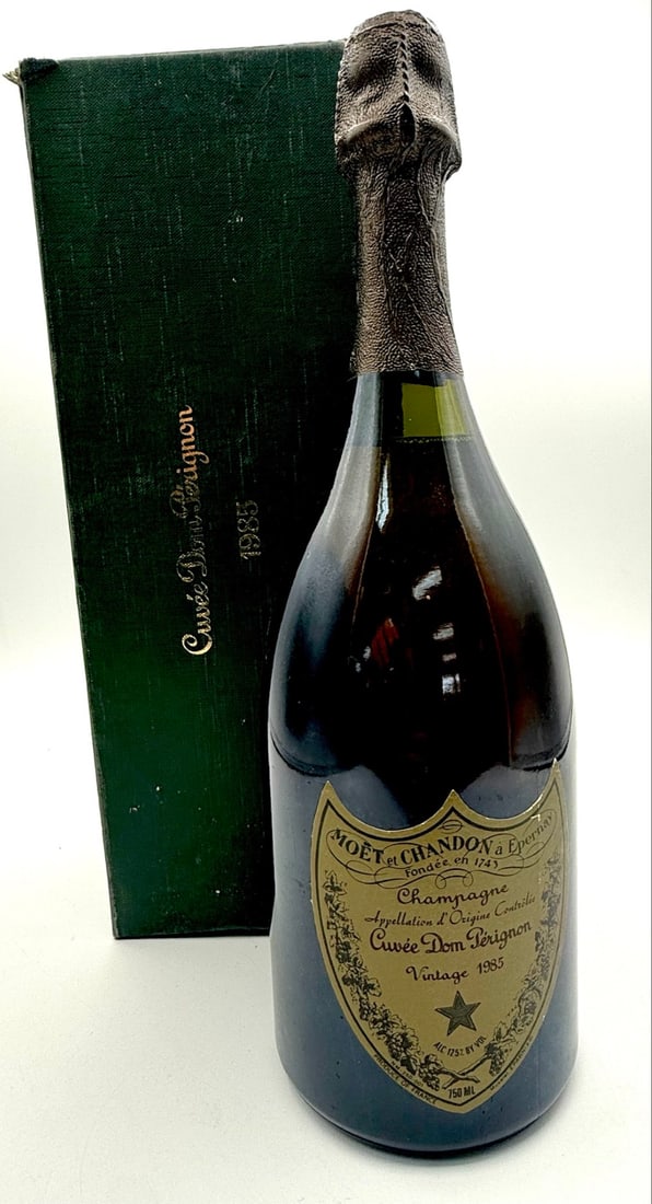 Unopened Bottle Of 1985 Cuvee Dom Perignon Champagne In Box: Unopened 750ml bottle of 1987 Cuvee Dom Perignon Champagne in the original box. Box shows some wear, includes paperwork.