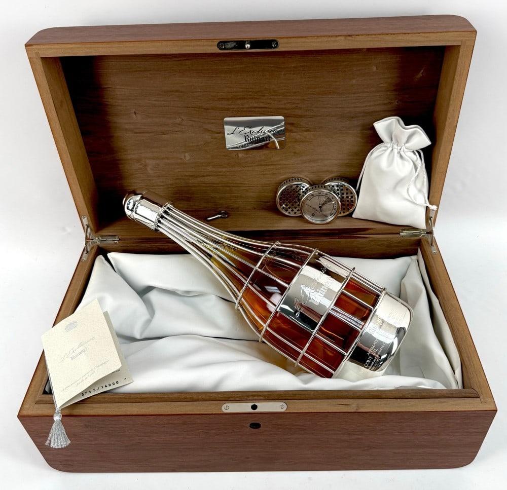 2000 Ruinart L'Exclusive Brut Champagne Limited Edition Magnum Bottle: 2000 Ruinart L'Exclusive Brut Champagne Limited Edition Magnum Bottle. The unopened bottle comes in a lined wooden gift box from the Bellagio Hotel. The bottle has a silver-plate cage and cap around t