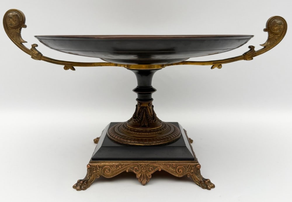 Antique French Gilt Bronze Tazza With Mythological Medallion: Antique French Gilt Bronze Tazza With Mythological Medallion. Features handles and and a slate base on claw feet. Excellent condition with some expected age and use wear. Measures approximately 8" tal