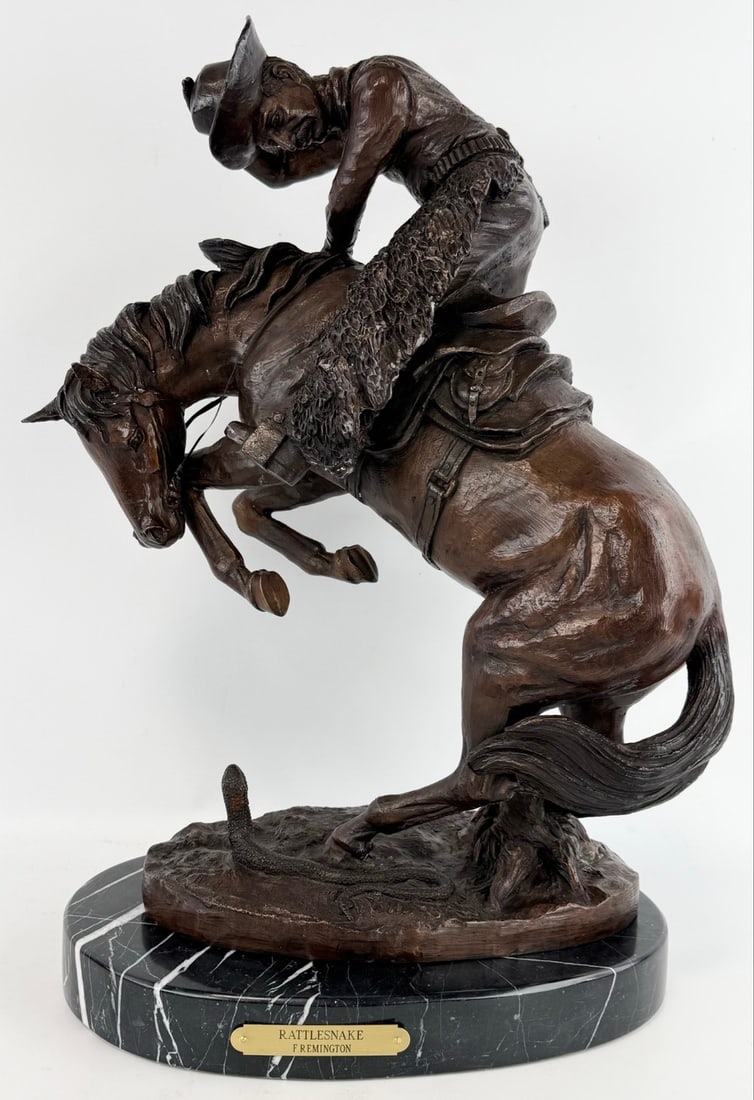 Frederic Remington "Rattlesnake" Bronze Sculpture: Bronze statue titled "Rattlesnake" After Frederic Remington. The bronze featuring a cowboy on a horse being spooked by a rattlesnake. The bronze is mounted on a marble base and is signed Frederic Remi