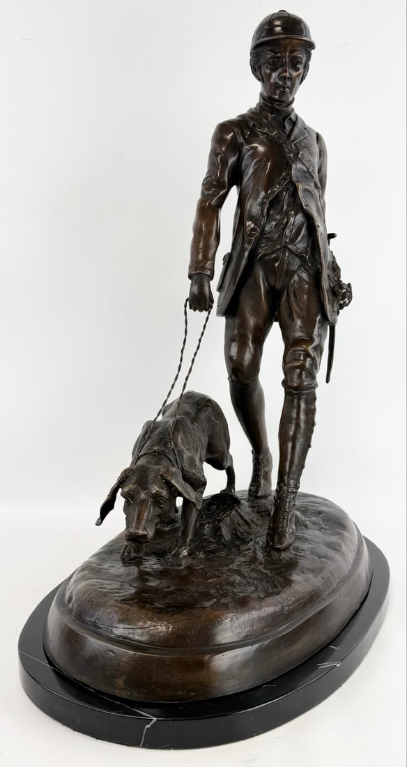 English Hunter With Hound Bronze Statue: English Hunter with hound bronze statue on marble base. The bronze is in great condition with quality detail. It measure approximately 25" tall x 20" across x 12-1/2" deep.