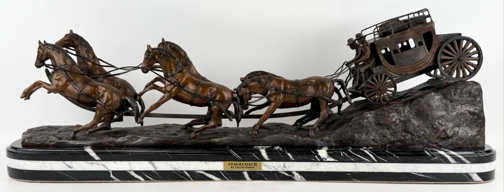 Large "Stagecoach" Bronze Sculpture After Charles Russell: Bronze sculpture titled "Stagecoach" After Charles Russell. The bronze features a stagecoach with two drivers and a six horse team. The bronze is mounted on a triple marble base and is signed Charles