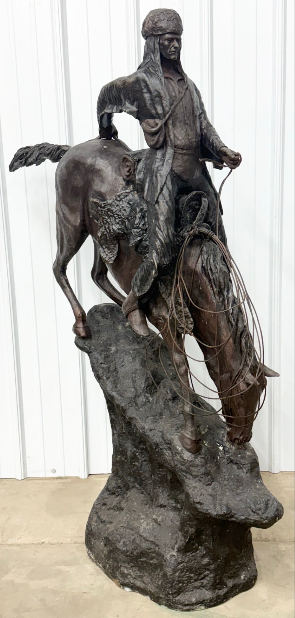 After Frederic Remington P.J. Mene "The Mountain Man" 60" Bronze Sculpture: Large bronze statue titled "The Mountain Man" After Frederic Remington by P.J. Mene. The bronze features a man on his horse riding down a mountain slope. The bronze displays well and has great detail.