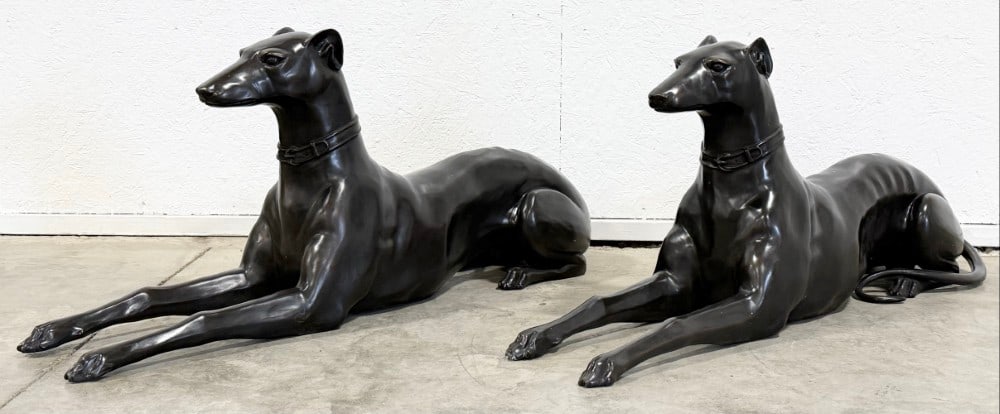 Pair Of Life Size Laying Whippet Dog Bronze Statues: Pair Of Life Size Laying Whippet Dog Bronze Statues. The statues have great detail and workmanship. Overall the bronzes measure approximately 9-1/2" across x 19" tall x 45" deep.
