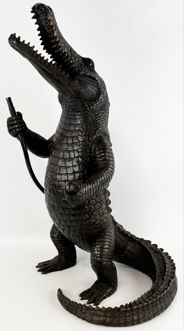 Alligator Smoking Cigar & Holding A Garden Hose Bronze Fountain: Alligator Smoking Cigar & Hold A Garden Hose Bronze Fountain. Has great detail and quality workmanship. Overall the fountain measures approximately 14" across x 31-1/2" tall x 15" deep. Pump not inclu