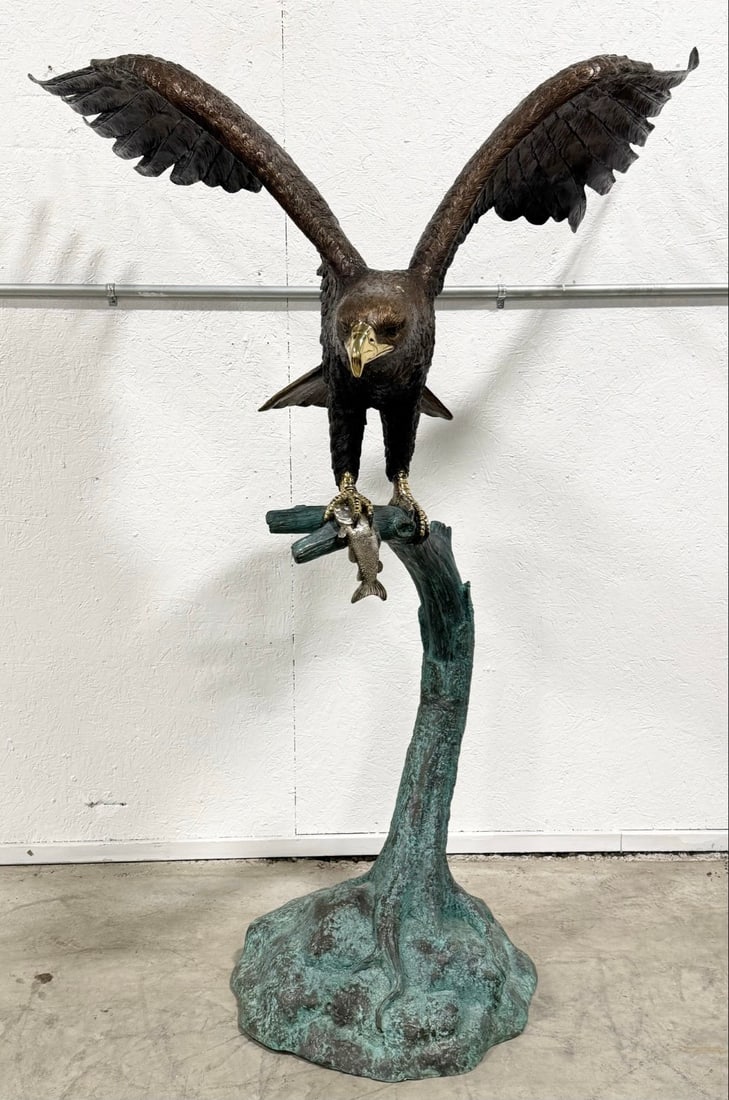 Life Size Eagle On Branch With Fish Bronze Statue: Life Size Eagle On Branch With Fish Bronze Statue. The bronze has great detail and workmanship. Has gold & silver accents with a patinated base. Overall the statue measures approximately 47" across x