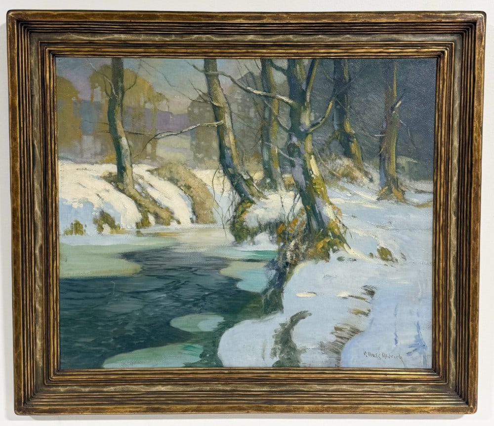 George Ames Aldrich Winter Brook Oil On Board Painting: Oil on board painting by listed Indiana artist George Ames Aldrich (1872-1941). The painting features a Brown County Wooded Brook in Winter. Signed in the lower right and in the original frame. Sight