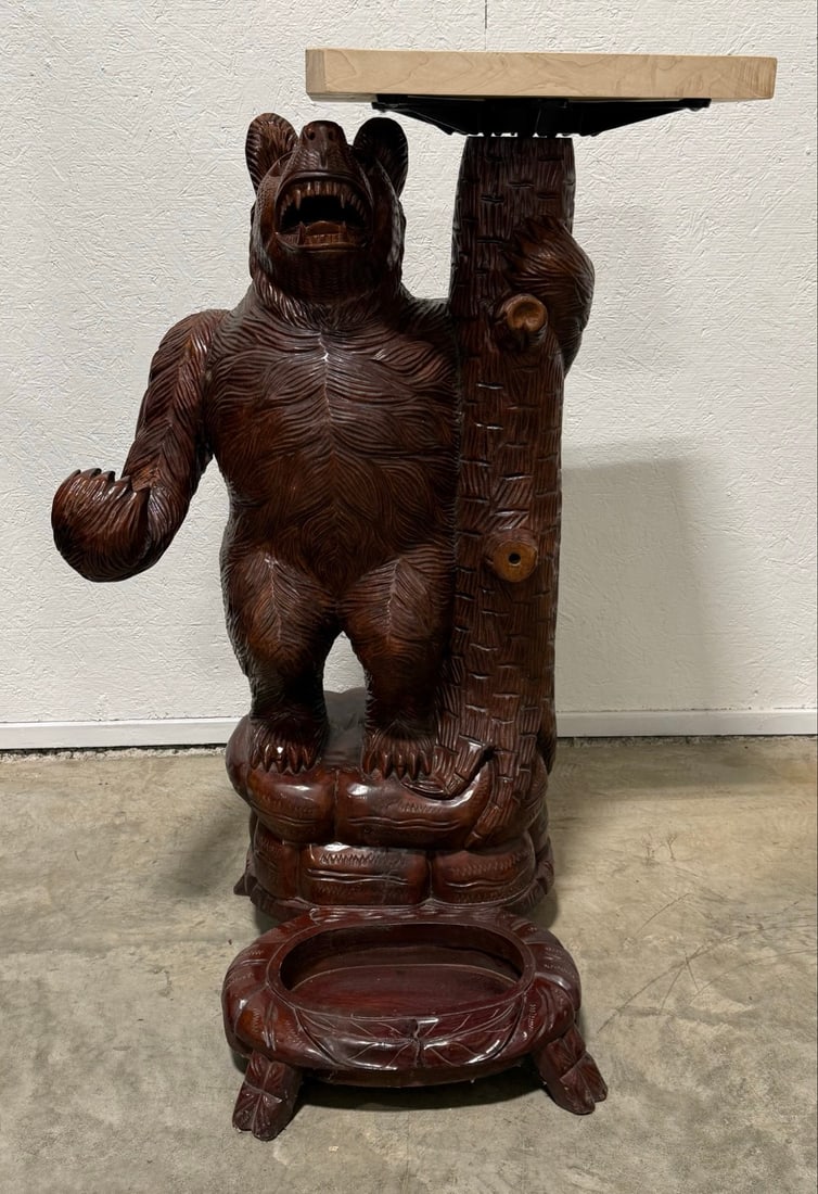 Vintage Black Forest Style Carved Bear Hall Tree: Vintage Black Forest Style Carved Bear Hall Tree. The base features a space for umbrella?s and has a table top attached to a tree next to the bear. Looks like it may of had a carved rifle or limb atta