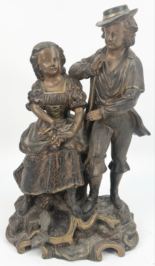 Antique Bronze Finish "Courting Couple" Spelter Statue: Antique Bronze Finish "Courting Couple" Spelter Statue. The statue is in good condition with gold painted accents. It shows some age and display wear, displays well. Marked HB423 on the base. Measures