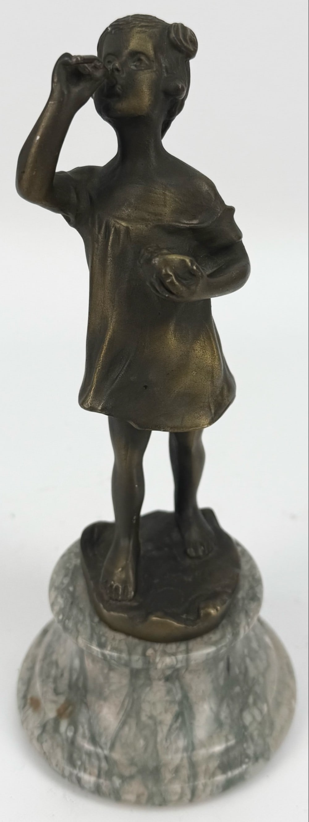 After Cricaro "Girl Blowing Bubbles" Bronze Sculpture: After Cricaro "Girl Blowing Bubbles" Bronze Sculpture. The sculpture comes on a marble base, unsigned. Displays well and has nice detail. Measures approximately 9" tall x 3-7/8" across including the m