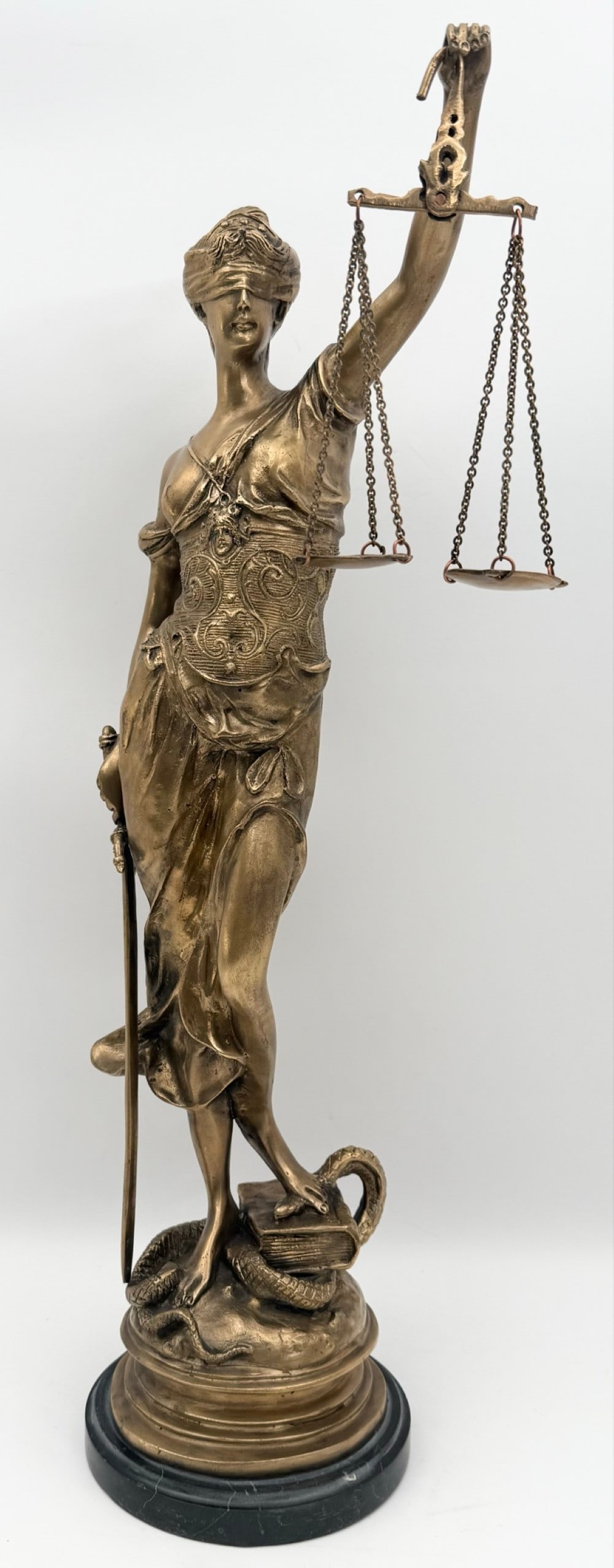 After Auguste Moreau "Lady Justice" Bronze Sculpture: After Auguste Moreau "Lady Justice" Gold Patina Bronze Sculpture. The sculpture comes on a slate base and is signed on the back. Displays well and has nice detail, has some light age and display wear.