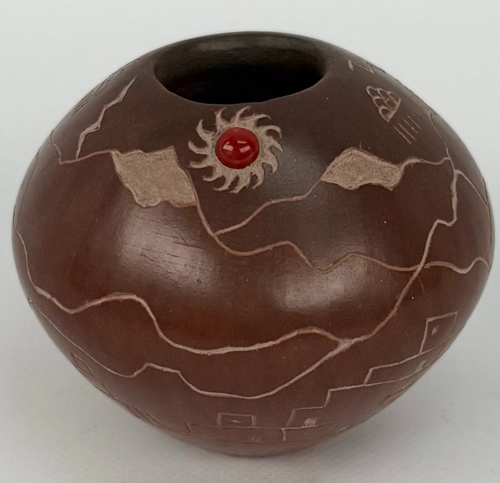 Dusty Naranjo Santa Clara Pueblo Pottery Pot With Coral Stone & Etchings: Etched Pottery Pot by listed Santa Clara Pueblo artist Dusty Naranjo (Born 1968). The pot includes mountain & village etchings with an oval coral stone at the top. Signed on the base. Great condition