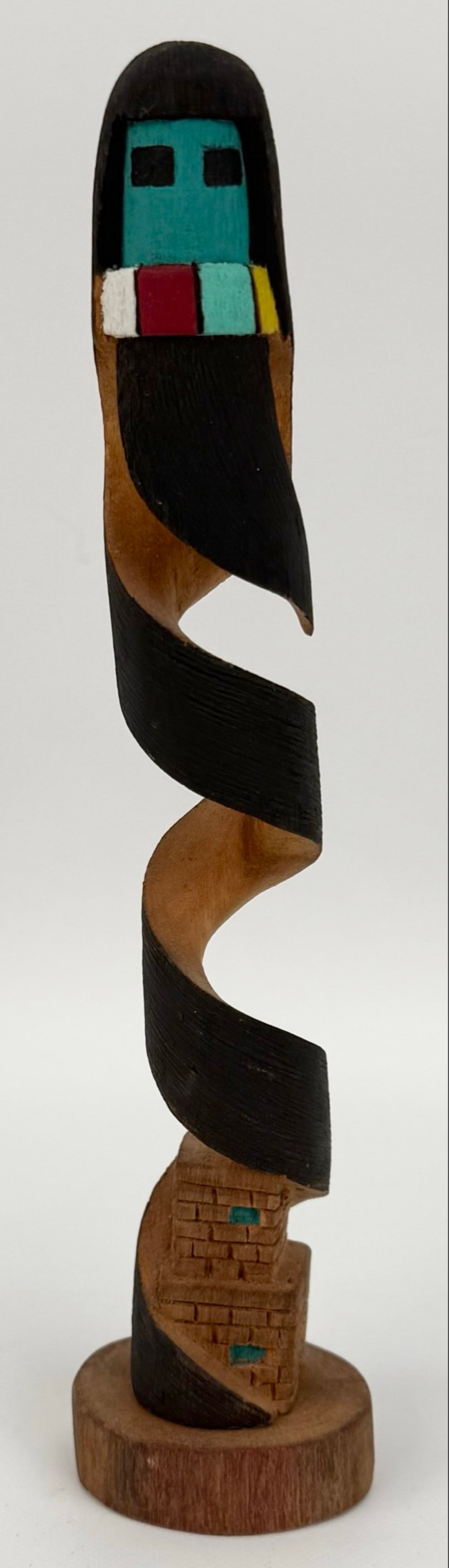 Signed P. Cheromiah "Longhair" Hopi Kachina Doll: Hopi Pueblo Kachina Doll by listed artist P. Cheromiah. The Kachina is titled "Longhair" and features a spiral design. Good condition with no visible damage. Measures approximately 2" across x 8" tall