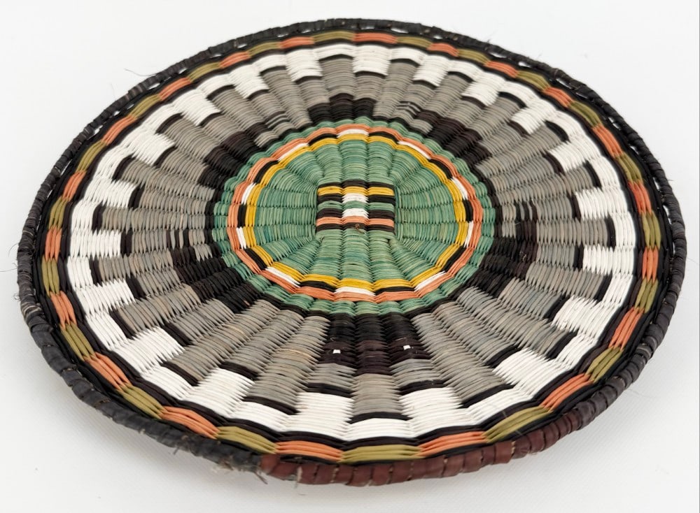 Hopi Native American Hand-Crafted Wedding Basket: Hopi Hand-Crafted Wedding Basket. Features green, white, gray and orange colors. Displays well and measures 10" in diameter.