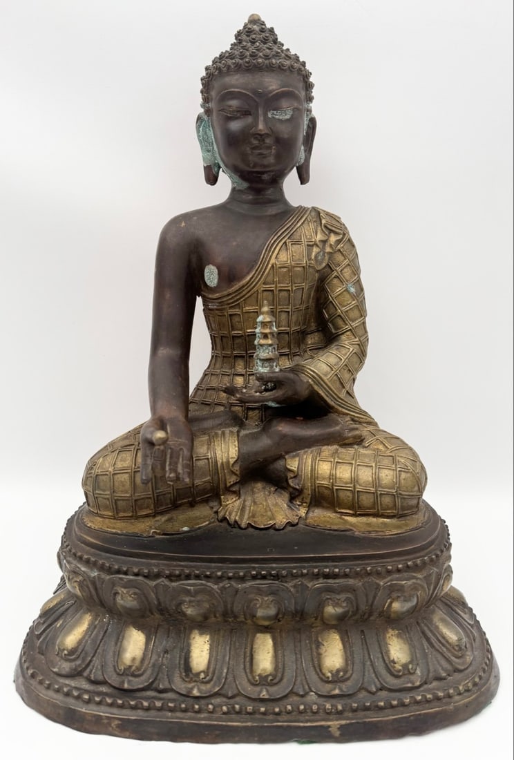 Vintage Bronze & Brass Tibetan Shakyamuni Buddha Statue: Vintage Bronze And Brass Shakyamuni Buddha Statue. The piece has intricate detail with some age and display wear, has some green patina spots. Measures approximately 16" tall x 11-5/8" across x 9" dee
