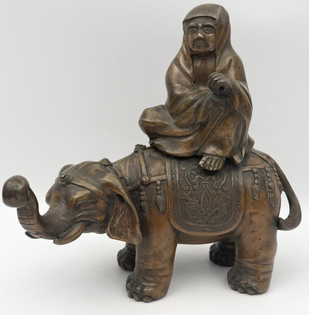 Antique Chinese Daruma Daishi Monk Riding Elephant Bronze Incense Burner: Antique Chinese Daruma Daishi Monk Riding Elephant Figural Bronze Incense Burner. The piece has nice detail, the monk lid is stuck shut and needs some work to be removed. Good condition with some age