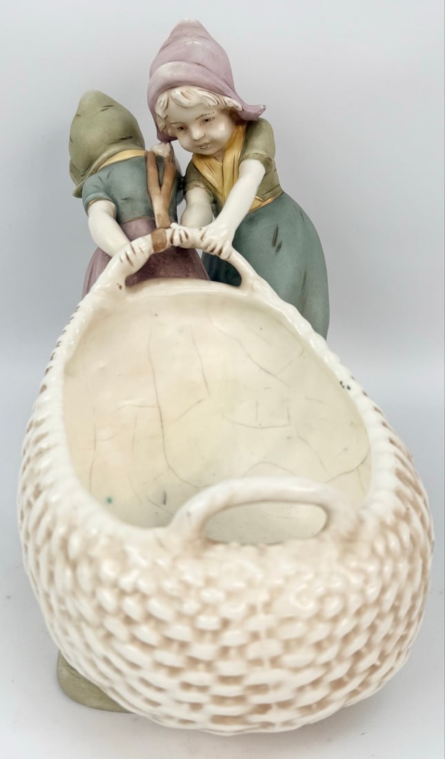 Antique Royal Dux Bohemia Art Nouveau Porcelain Dutch Girls Planter: Antique Royal Dux Bohemia Art Nouveau Porcelain Figural Planter. The piece features two Dutch girls pulling a fish net planter bowl. The piece is marked on the base with the number 9903. The condition