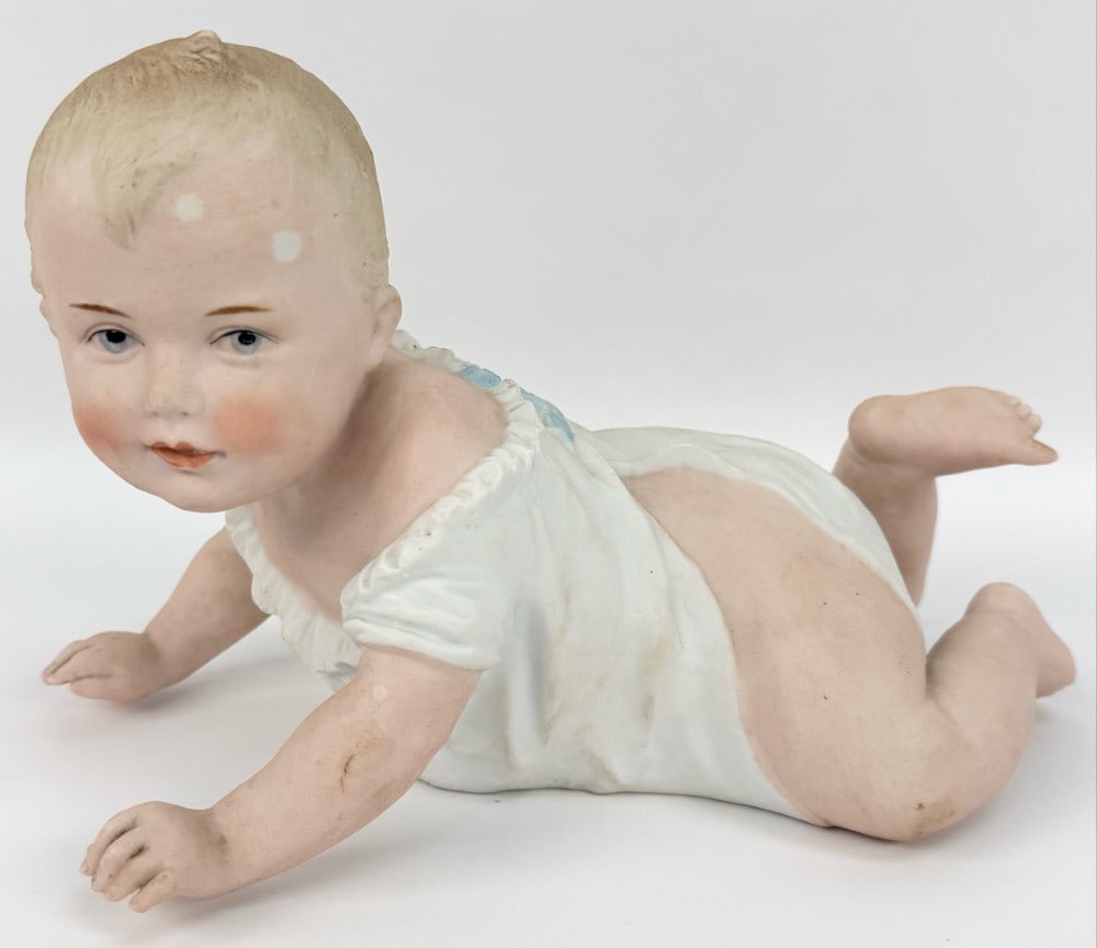 Antique Gebruder Heubach Bisque Porcelain Piano Baby #8101: Antique Gebruder Heubach Bisque Porcelain Piano Baby #8101. The German piano baby is crawling with it's head up, measures 10-1/2" across. Nice condition with no chips or cracks, has some very light pa