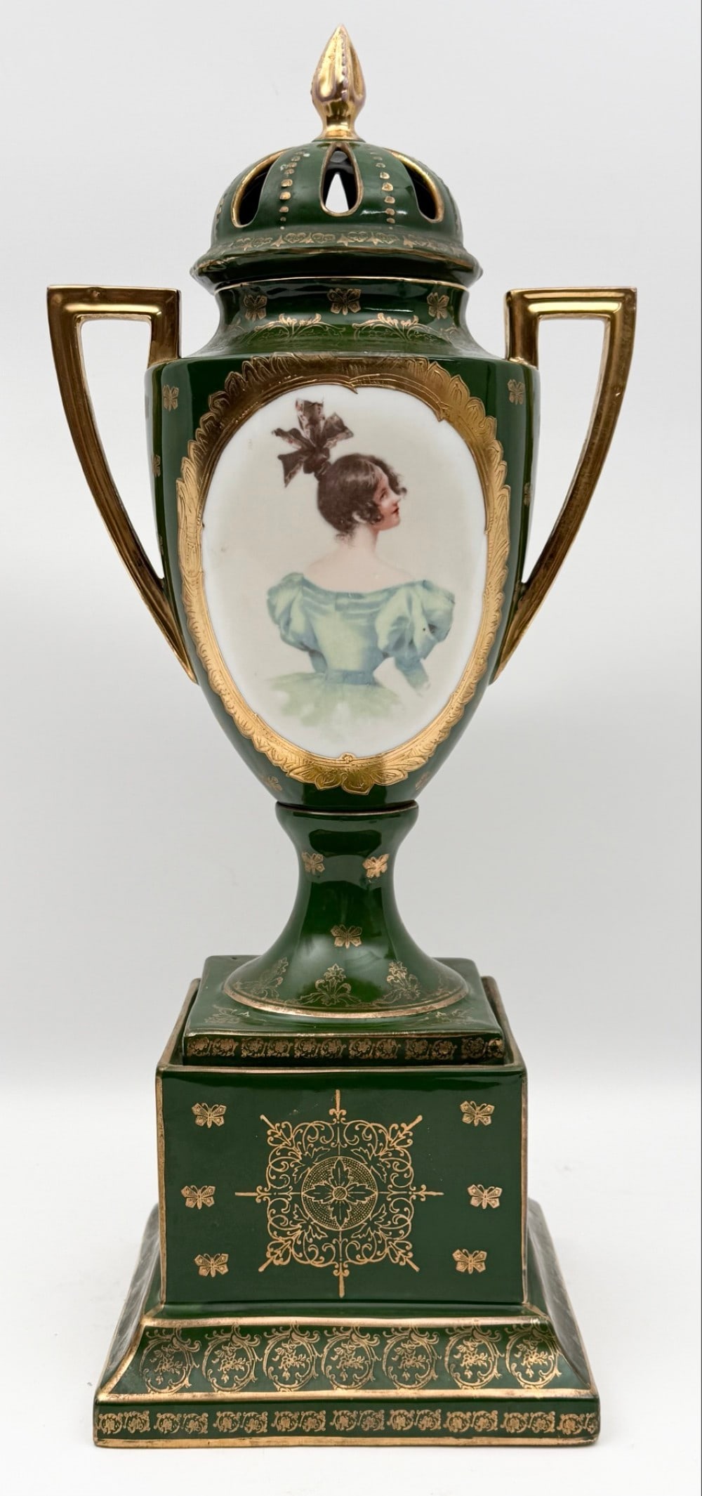 Antique Victoria Carlsbad Austria Porcelain Portrait Urn: Antique Victoria Carlsbad Austria Portrait Urn. The lidded urn displays well with some wear to the gold accents and fading on the portraits, no chips or cracks. Measures approximately 17-3/4" tall x 8