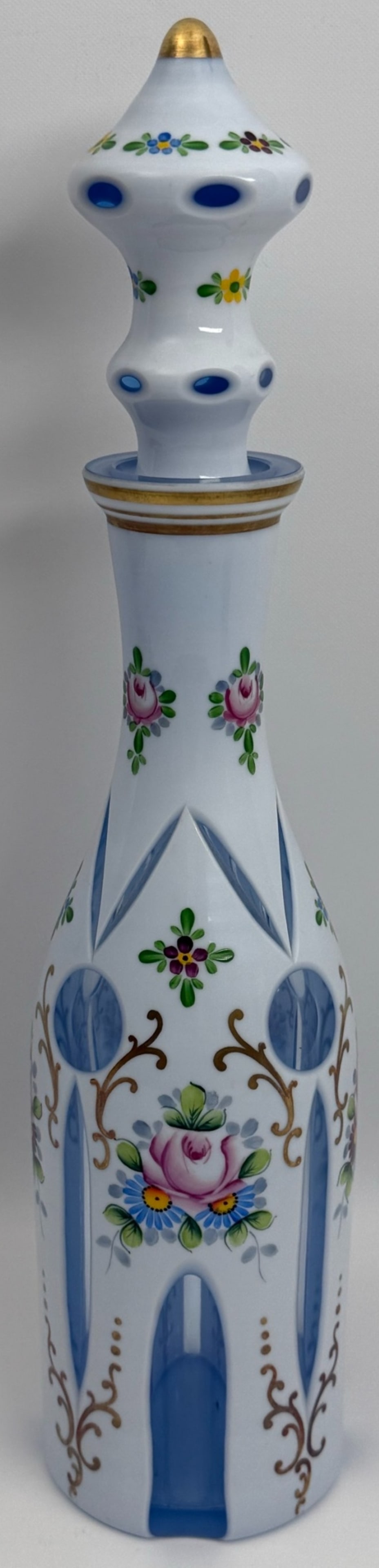 Vintage Bohemian Cased Glass Cut To Light Blue Decanter With Enamel Painted Flowers & Gold Scrolls: Vintage Bohemian Cased Glass Cut To Light Blue Decanter With Enamel Painted Flowers & Gold Scrolls. The decanter is in very good condition with no chips or cracks. Overall measures approximately 16-1/