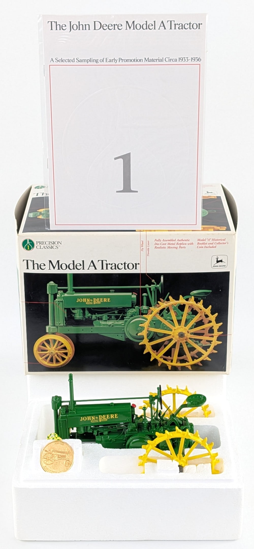 1/16 Ertl John Deere Model A Tractor Precision Classics #1: 1/16 Ertl John Deere Model A tractor Precision Classics Series #1. Good condition in the box with the medallion and pamphlet. Very nice and highly detailed.