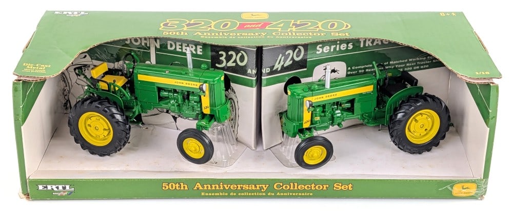 1/16 Ertl John Deere 320 and 420 Tractor Set: 1/16 Ertl John Deere 320 and 420 tractor set. 50th anniversary collector set. Good condition in the box.