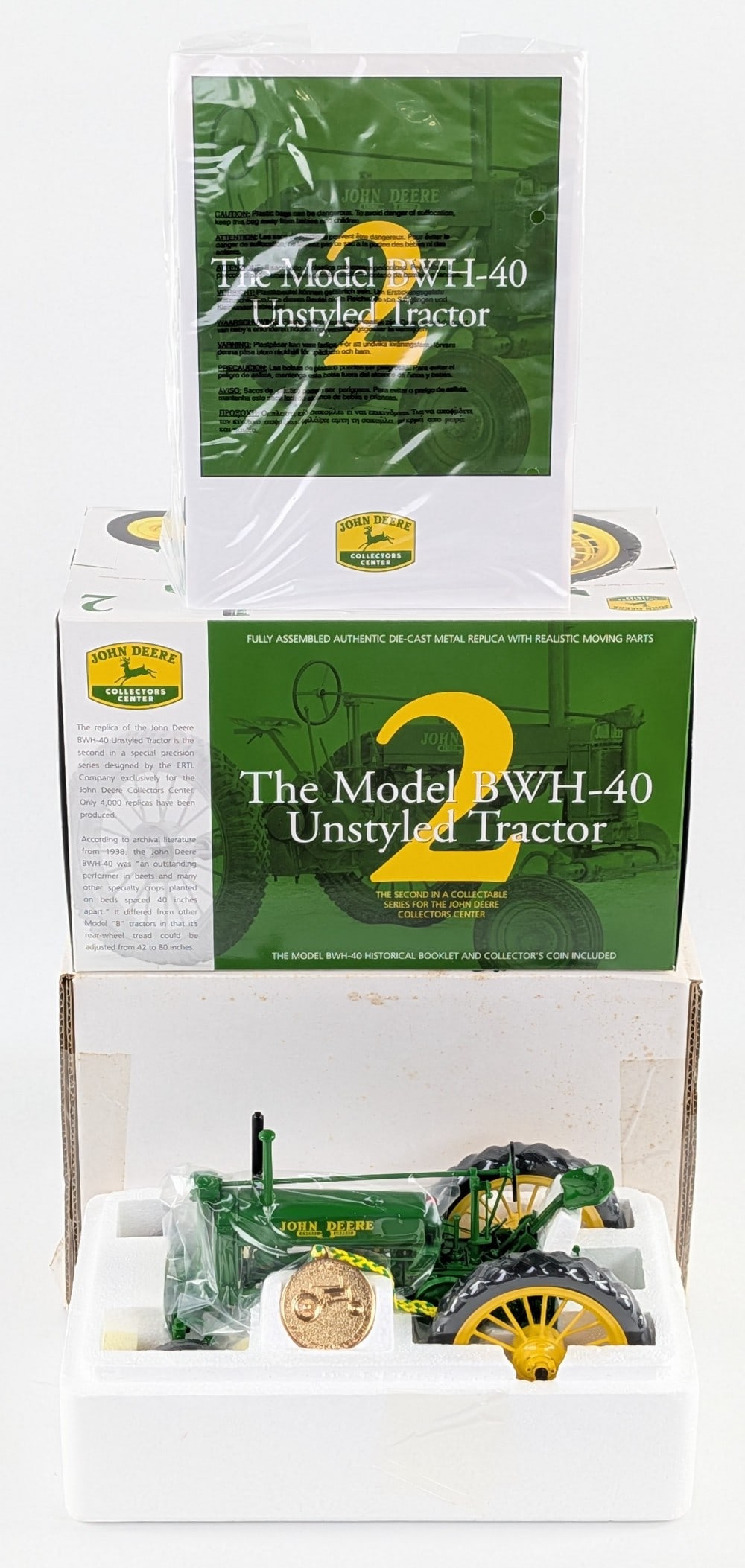 1/16 Ertl John Deere Model BWH-40 Unstyled Tractor Collector's Center #2: 1/16 Ertl John Deere Model BWH-40 Unstyled Tractor Collector's Center Series #2. Good condition new in the box with the booklet and medallion.
