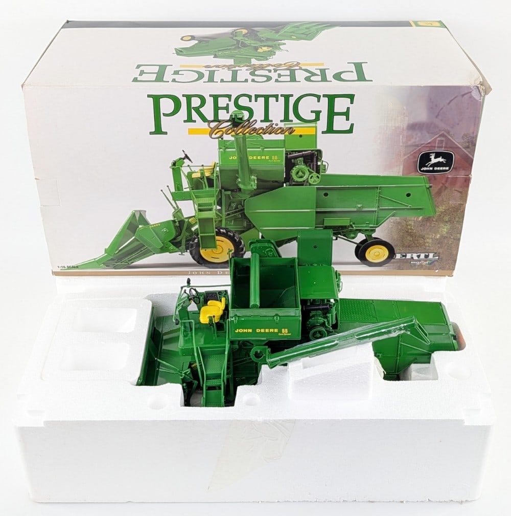 1/16 Ertl John Deere 55 Combine w/ Corn Head Prestige Collection Series: 1/16 Ertl John Deere 55 Combine with corn head Prestige Collection Series. Good condition new in the box and highly detailed.