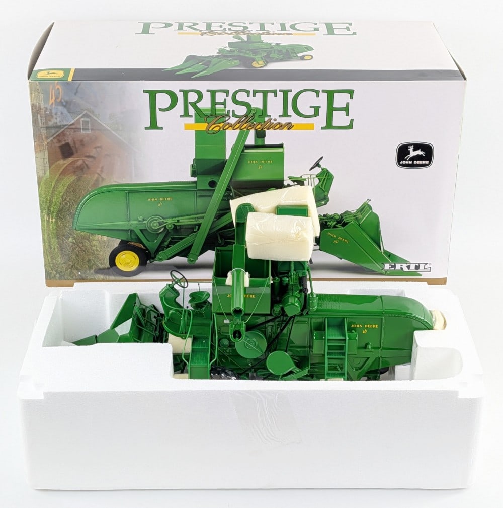 1/16 Ertl John Deere 45 Combine w/ Corn Head Prestige Collection Series: 1/16 Ertl John Deere 45 Combine with corn head Prestige Collection Series. Good condition new in the box and highly detailed.