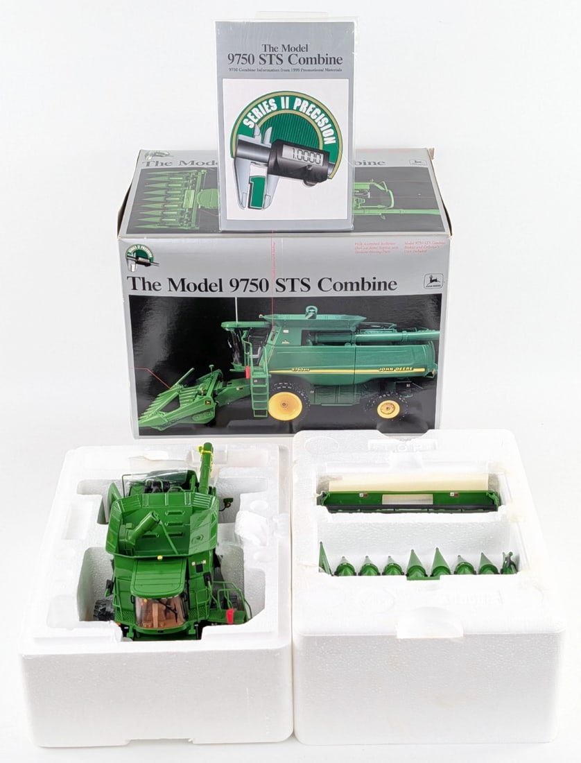 1/32 Ertl John Deere Model 9750 STS Combine w/ Both Heads Precsion Series: 1/32 Ertl John Deere Model 9750 STS combine with both heads. Series II Precision #1. Good condition new in the box with the booklet and collector's coin. A nice highly detailed replica.